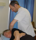 Spinal manipulation of a patient to alleviate neck pain and back pain at one of the osteopath clinics